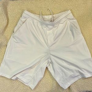 Men’s Lululemon size Large 9” inseam Lined Shorts. Color is White.